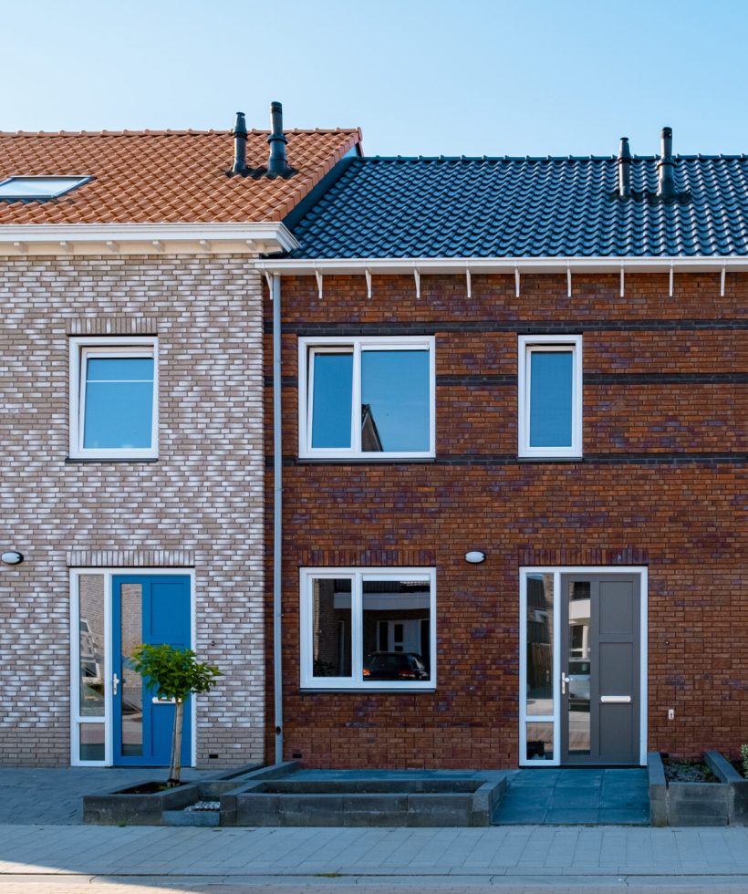 Dutch Suburban area with modern family houses, newly build modern family homes in the Netherlands, dutch family houses in the Netherlands, newly build streets with modern houses.